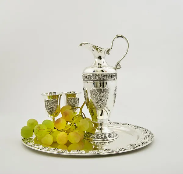 stock image Silver ware - a jug and glasses for wine