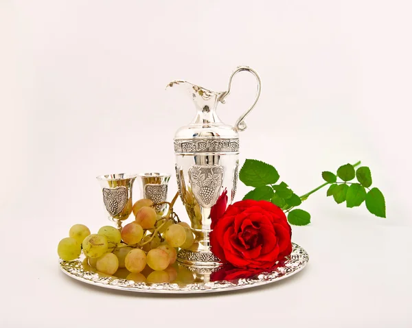 stock image Silver ware - a jug and glasses for wine