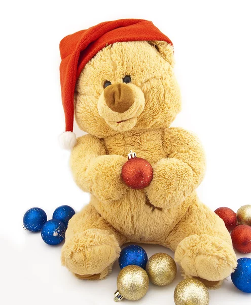 Spielzeugbär in der Weihnachtsmütze — Stockfoto