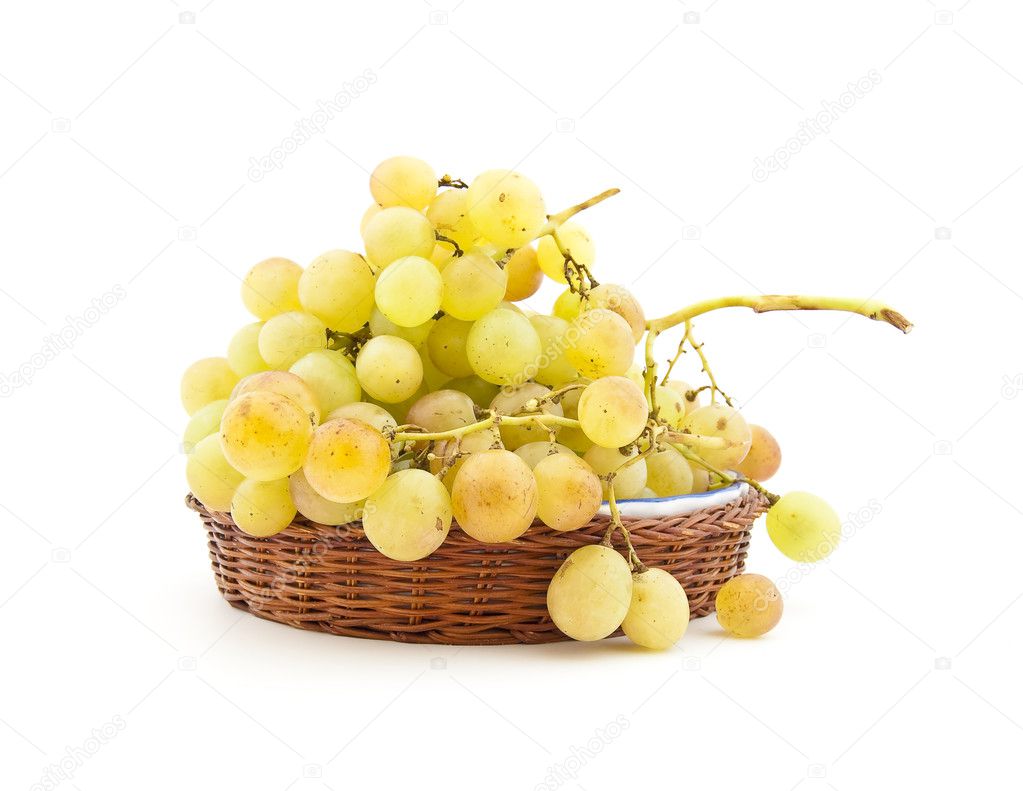 Clusters of ripe muscat grapes on a dish