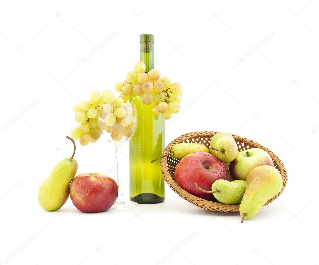 Bottle of white wine with fruits