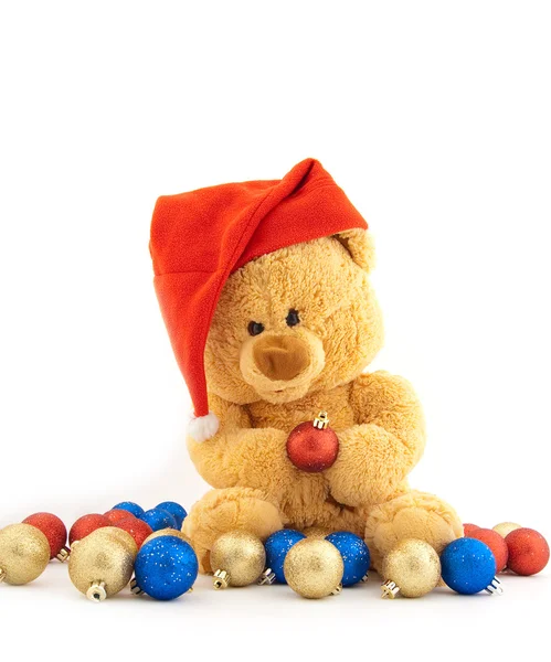 Urso de brinquedo em um boné de Natal — Fotografia de Stock
