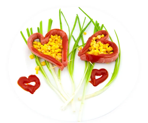 Due salsiccia fritta nella forma di cuore — Foto Stock