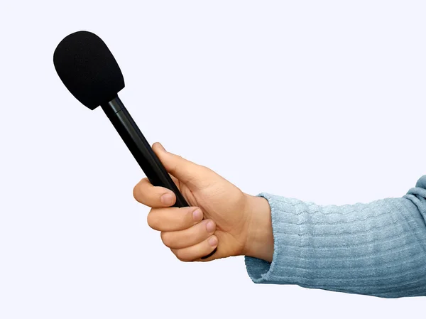 Mão com microfone portátil — Fotografia de Stock