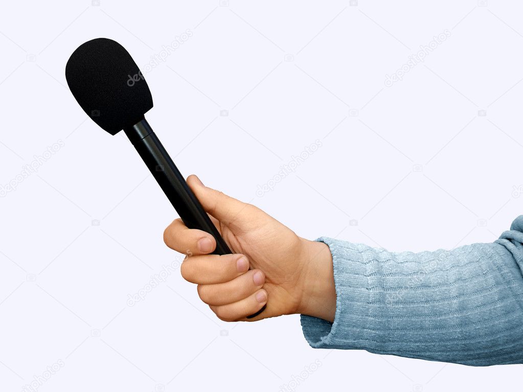 Hand with handheld microphone