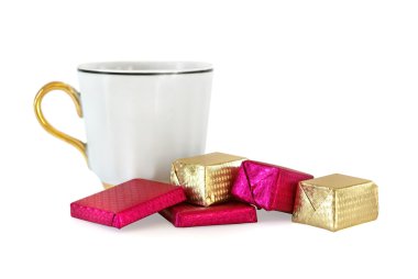 Cup and sweet chocolates clipart