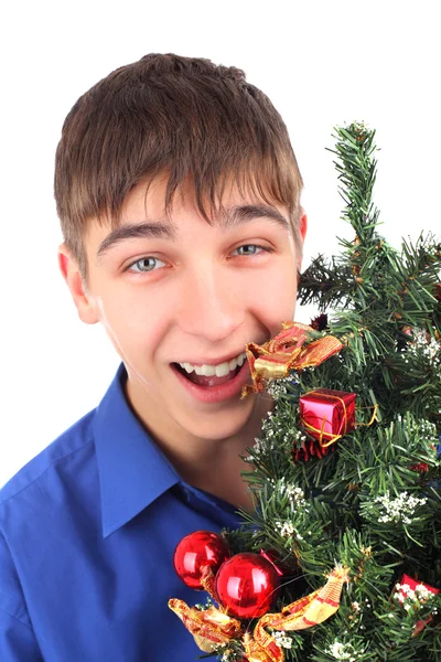 Teenager with christmas tree — Stock Photo, Image