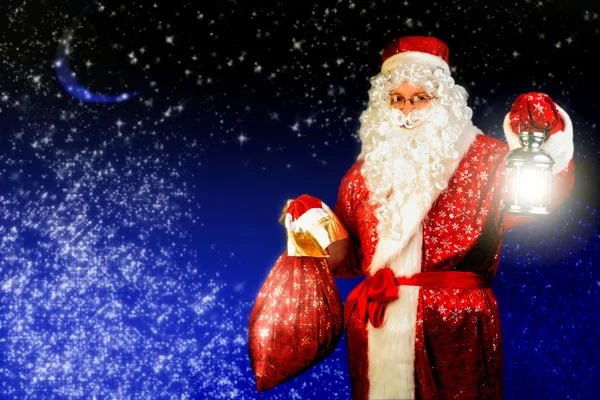 Weihnachtsmann mit Lampe — Stockfoto
