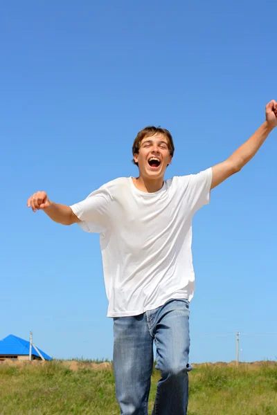 Szczęśliwy nastolatek działa — Zdjęcie stockowe