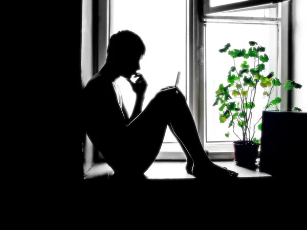 Teenager near the window — Stock Photo, Image