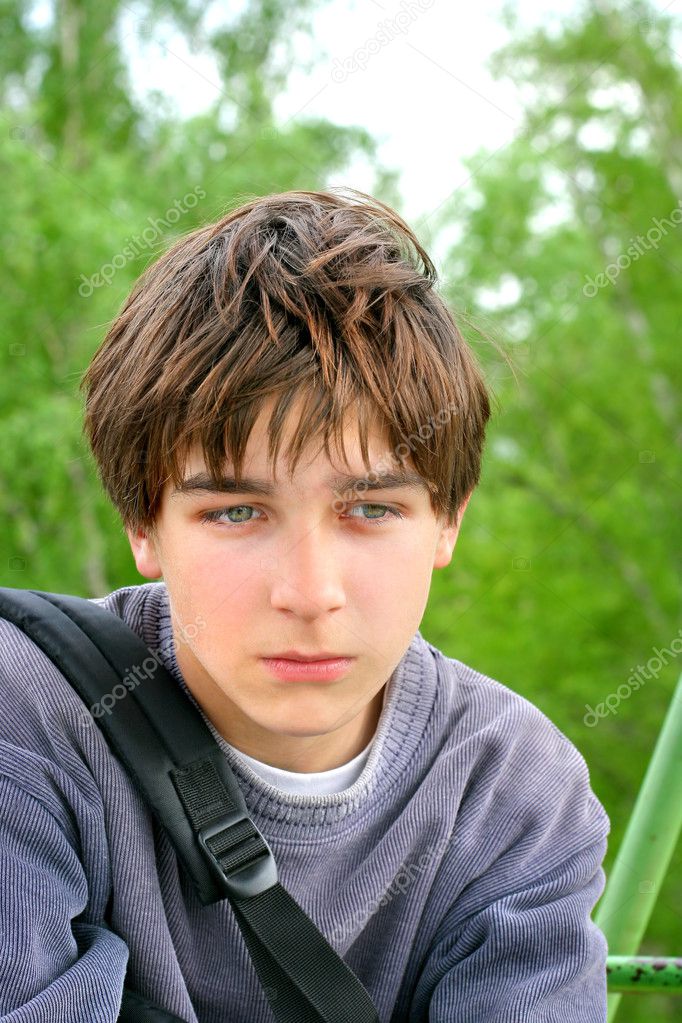 teenage boy with brown hair and green eyes