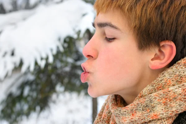 Teenager blowing — Stock Photo, Image