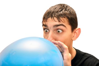 Teenager inflating a balloon clipart