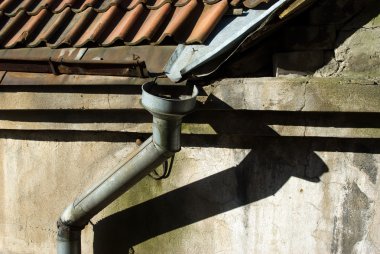 Old rain gutter with drainpipe clipart