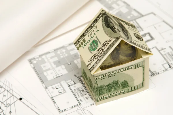 Huis gemaakt van geld — Stockfoto