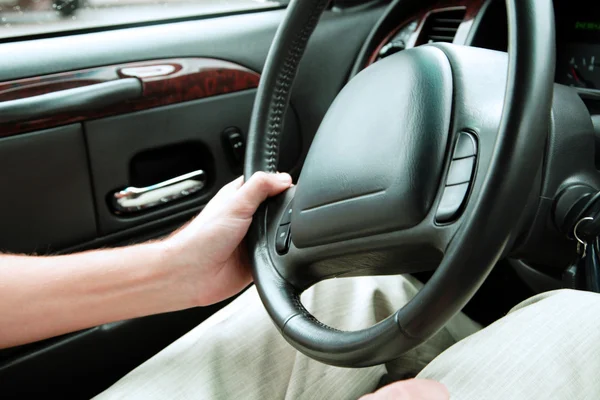 Driver holding steering wheel — Stock Photo, Image