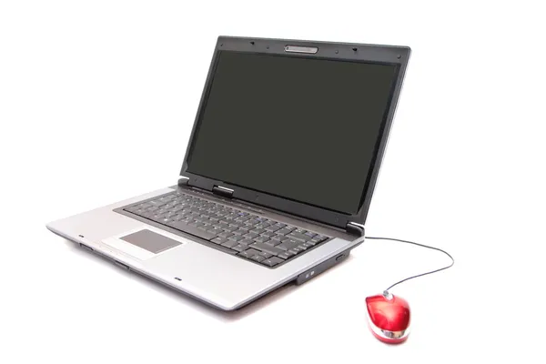 Личный компьютер и красная мышь — стоковое фото