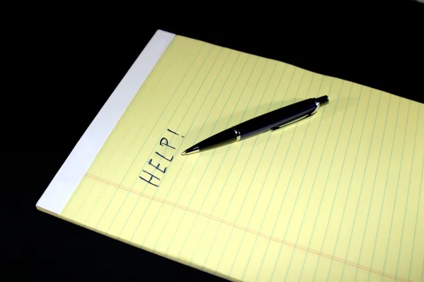 Bloco de notas Pen Help — Fotografia de Stock