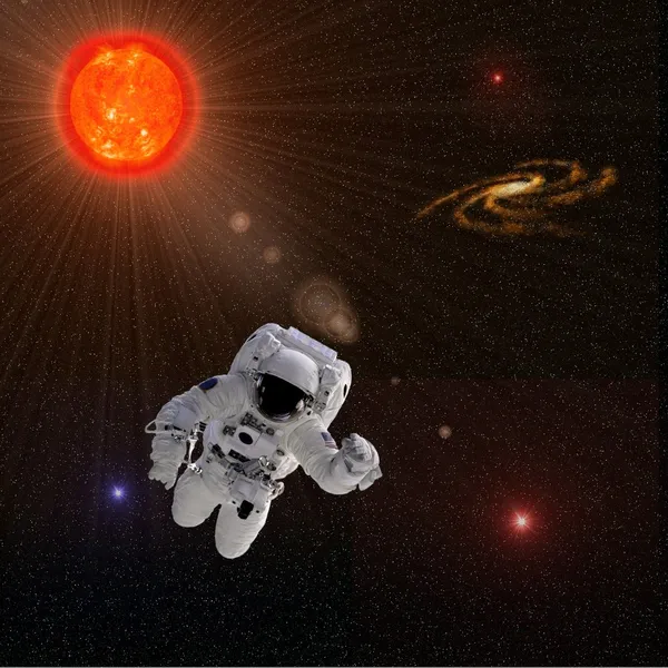 Астронавт і сонце з зірками — стокове фото