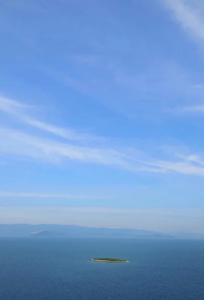 stock image Clouds and island