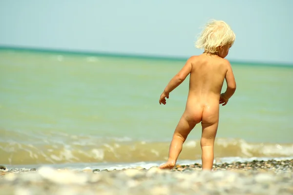 stock image A child on the beach.