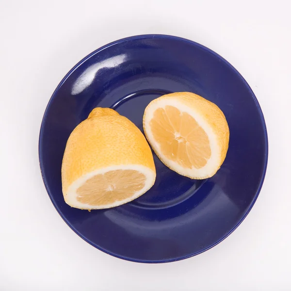 Plate with a lemon — Stock Photo, Image