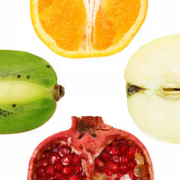 Four halved fruit — Stock Photo, Image