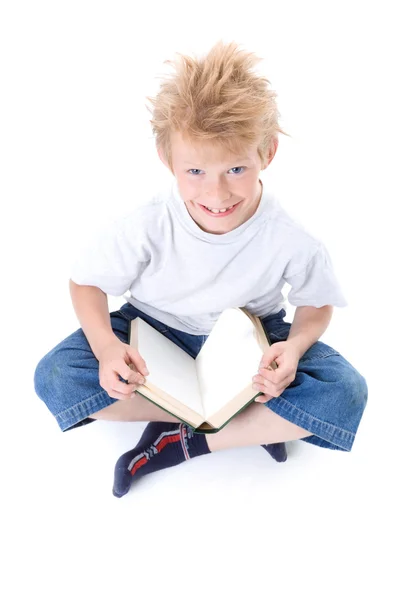The boy reads — Stock Photo, Image