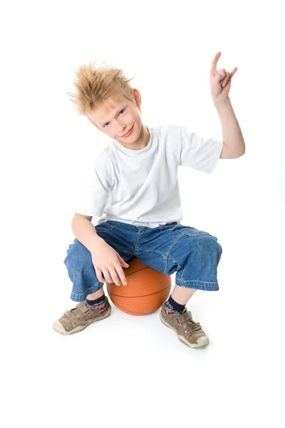 stock image The boy with a basketball ball on white