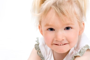 Cute little girl looking at the camera clipart