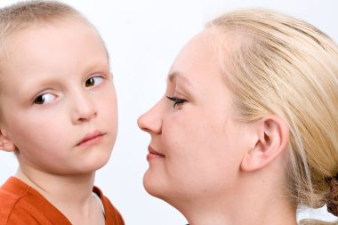 Sad boy with his mother on white clipart