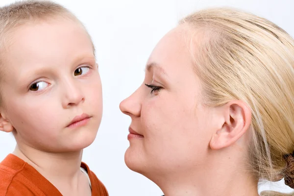 Sad boy with his mother on white — Stock Photo, Image