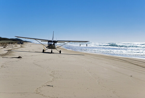 Airplane landing on the beach