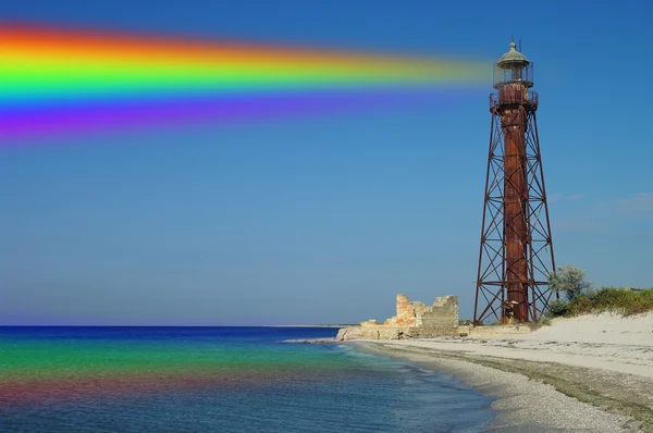 Rainbow and old beacon — Stock Photo, Image