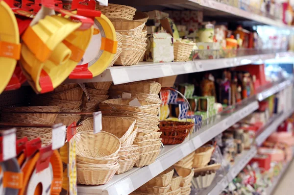 Shelves with goods in a supermarket — Stock Photo, Image