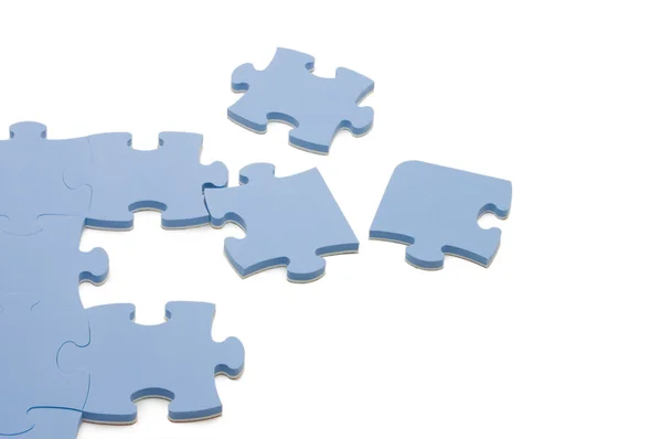Dropped out part of a blue puzzle — Stock Photo, Image
