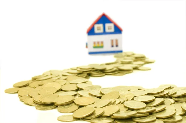 Golden coins and house — Stock Photo, Image