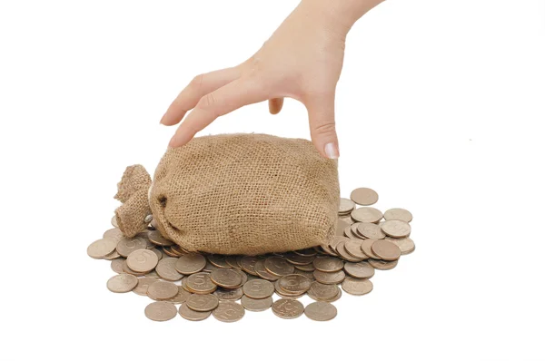 Mão alcance para sacos com moedas — Fotografia de Stock