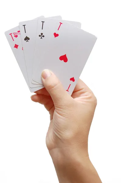 Ręka gracza odsłaniając cztery asy — Zdjęcie stockowe
