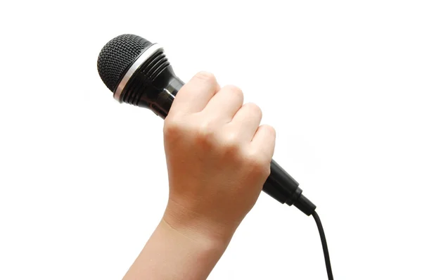 Рука держит микрофон — стоковое фото