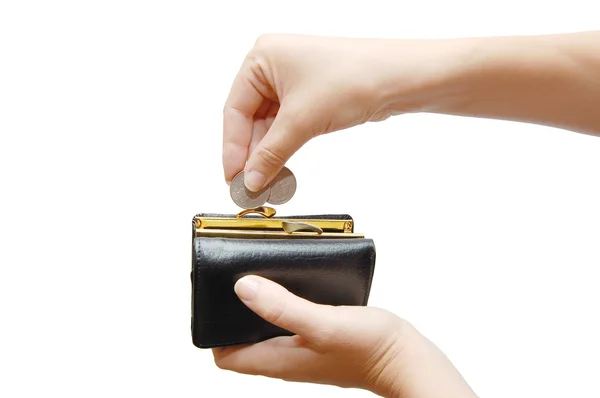 Svart plånbok och mynt i handen — Stockfoto