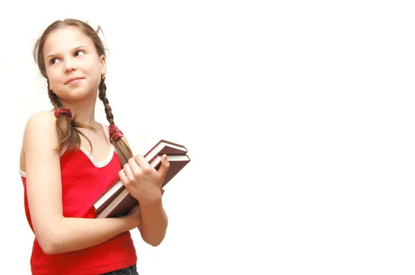 The girl in the red holds books — Stock Photo, Image