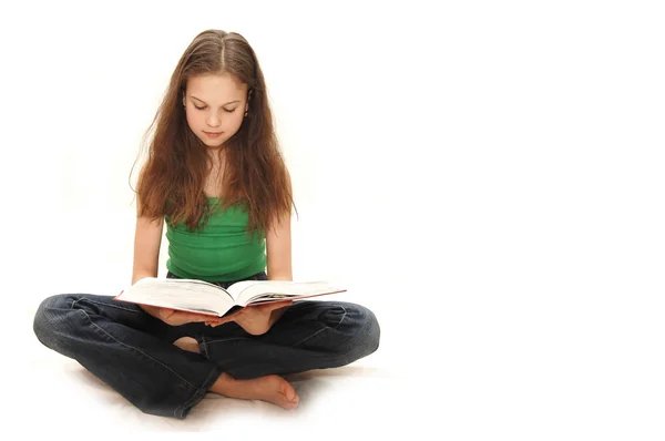 Young girl the teenager reads books — Stock Photo, Image
