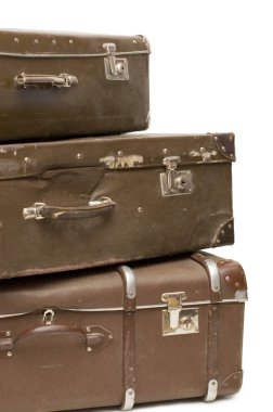 Heap of old suitcases isolated on white clipart