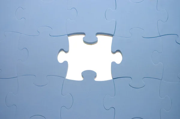 Dropped out part of a blue puzzle — Stock Photo, Image
