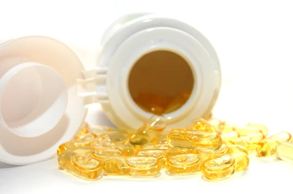 Pote de pílulas redondas amarelas - vitamina d — Fotografia de Stock
