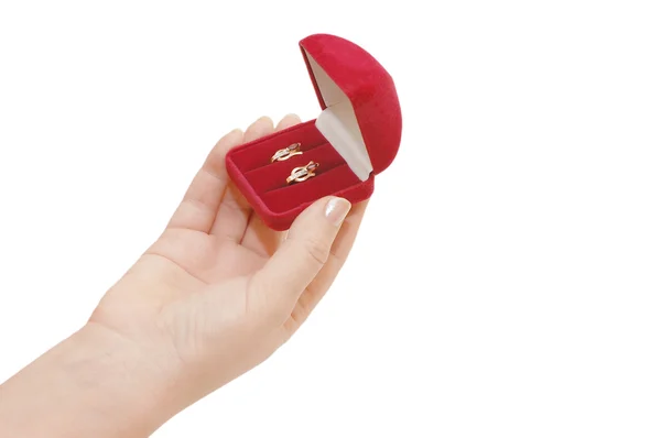 Rode doos met een juweel in een hand — Stockfoto