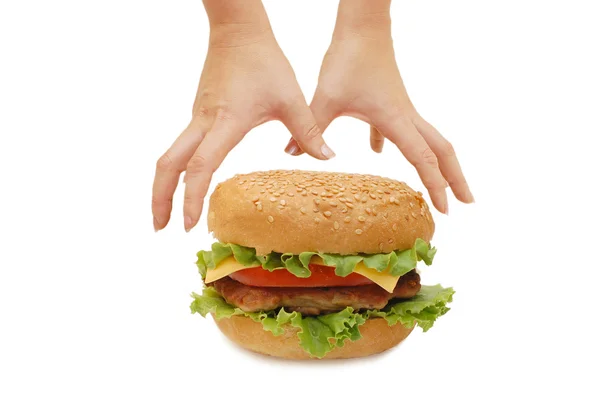 Hands reach for a hamburger isolated — Stock Photo, Image