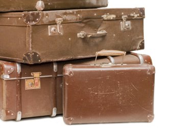 Heap of old suitcases isolated on white clipart