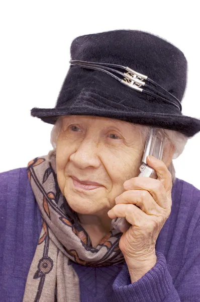 Bir cep telefonu ile konuşurken büyükanne — Stok fotoğraf